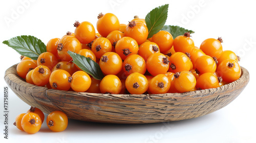 a wooden bowl filled with orange berries and green leaves on top of a white surface with leaves on the top of the bowl.