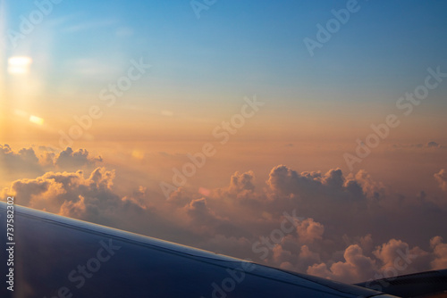 in the morning with a beautiful sunrise above the clouds by plane to Turkey Antalya