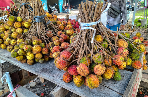 Closeup view of rambutan fruits at a market in Ungaran, Indonesia.
 photo