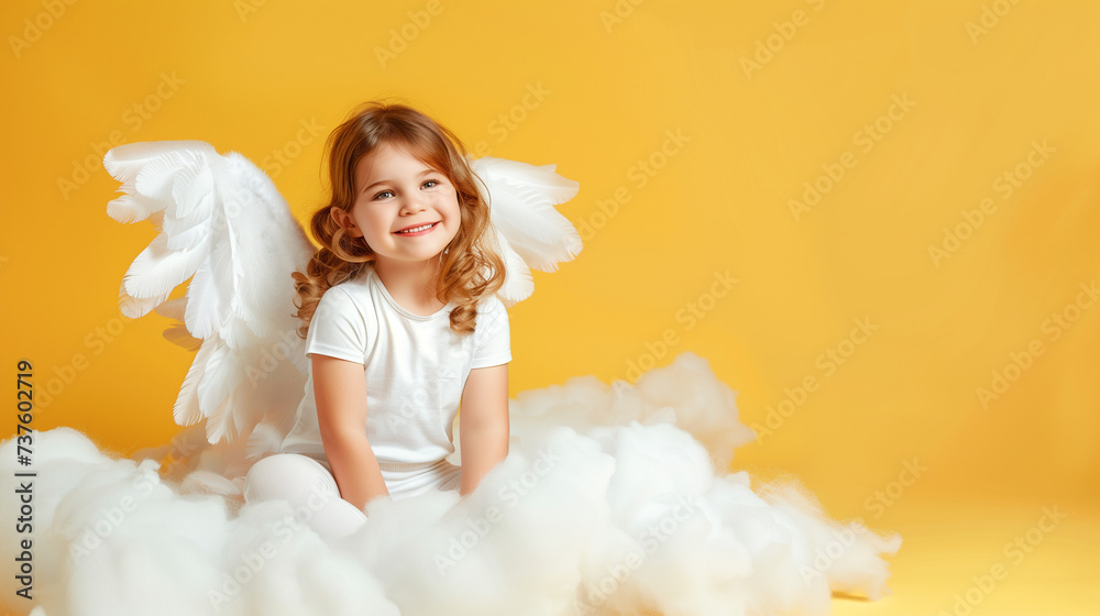 Baby Angel Wings, Angelic Cupid Kid, adorable girl Child sitting and posing at white cloud isolated on yellow background, with copy space. Baby Angel Wings, Angelic Cupid Kid, adorable girl Child sitting and posing at white cloud isolated on yellow background, with copy space.