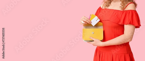 Young woman holding bag and...