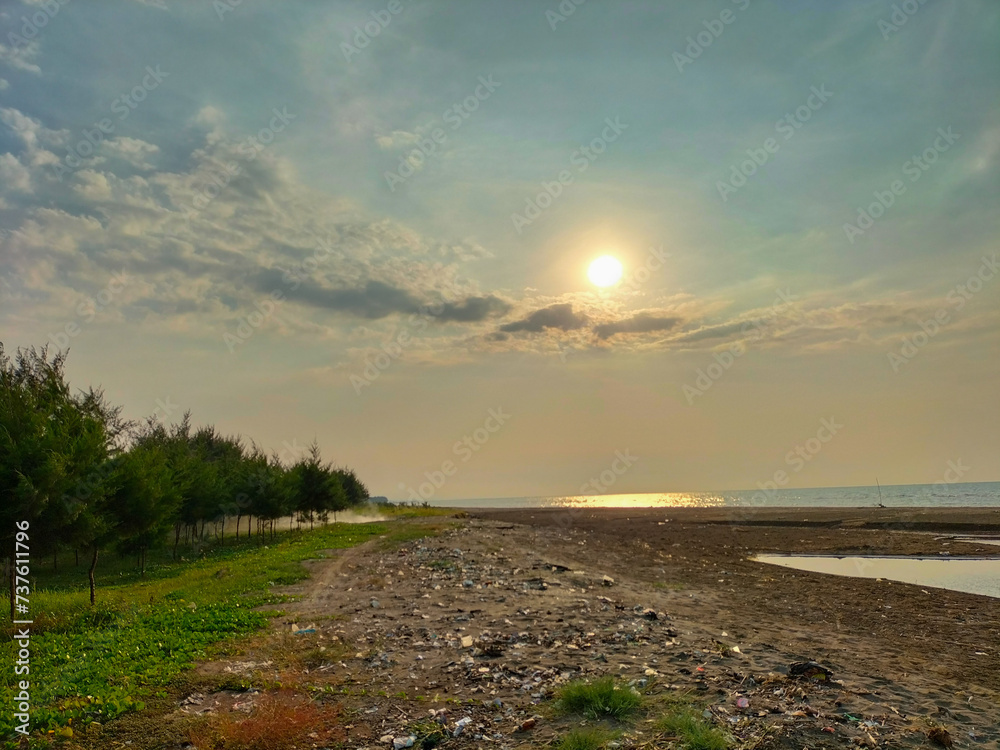 Beautiful view of sunset at a Cahaya Beach in Kendal, Central java, Indonesia.
Beautiful view of sunset at a Cahaya Beach in Kendal, Central java, Indonesia.