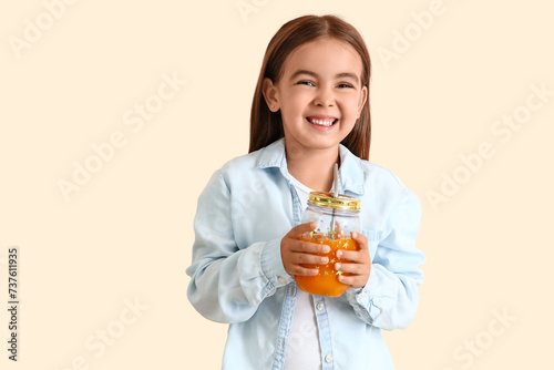 Cute little girl with glass...