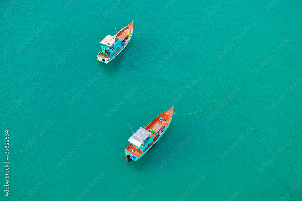 Aerial view from the cable car to the national Vietnamese wooden fishing boats on sea An Thoi harbor. Phu Quoc island, Vietnam.
