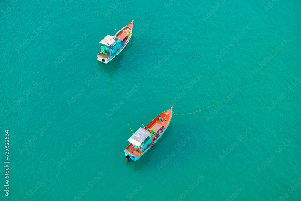 Aerial view from the cable car to the national Vietnamese wooden fishing boats on sea An Thoi harbor. Phu Quoc island, Vietnam. Aerial view from the cable car to the national Vietnamese wooden fishing boats on sea An Thoi harbor. Phu Quoc island, Vietnam.