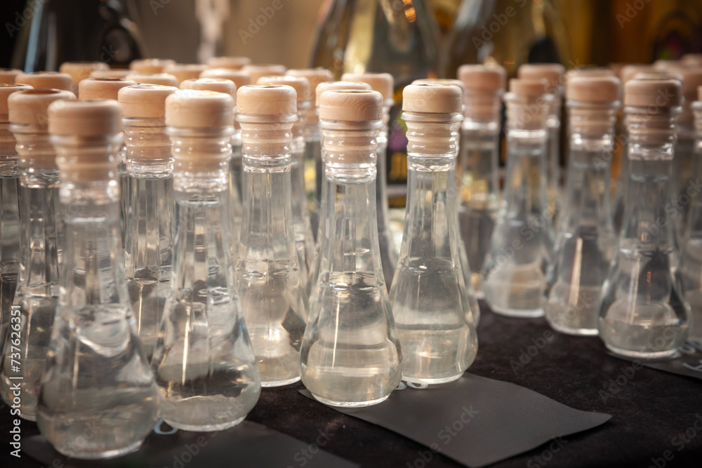 Obraz na płótnie Selective blur on rakija on display in typical serbian rakija glasses, cokanji. Rakija is a traditional brandy from Serbia and the rest of balkans, made of various fruits & Flavors. w salonie