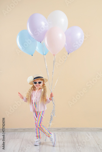 Happy little girl in sungla...
