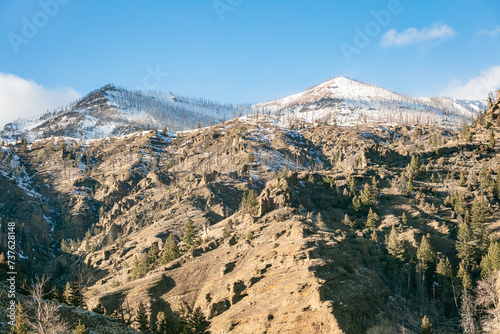 Snow-covered extreme terrain of the Absaroka Mountain Range in the Rocky Mountains of northwest Wyoming, USA photo