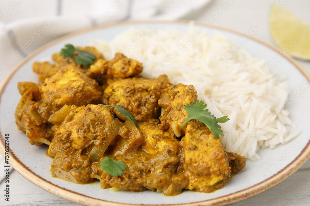 Delicious chicken curry with rice on table, closeup Delicious chicken curry with rice on table, closeup