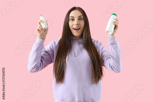 Young woman with bottles of...