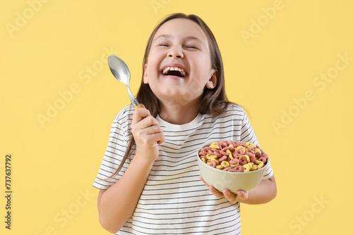 Happy little girl with bowl...