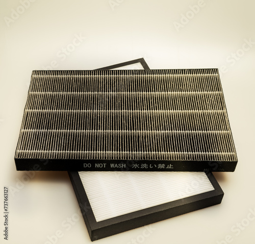 Studio shot of well used worn out dirty filters isolated against a white background.