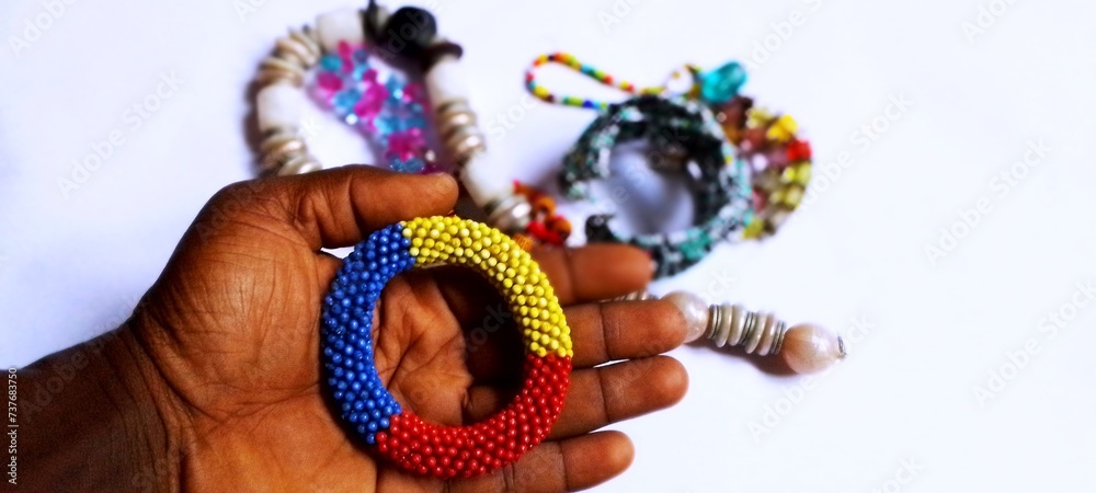 Hand holding colorful beads