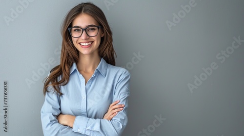Wallpaper Mural Happy young smiling confident professional business woman wearing blue shirt and glasses, happy pretty female executive looking at camera. Torontodigital.ca