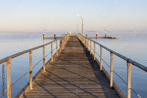 Obraz na płótnie The Meningie jetty on a calm sunny morning on the Coorong at Meningie South Australia on October 2nd 2023 w salonie
