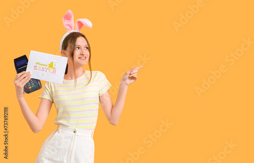 Young woman in bunny ears w...