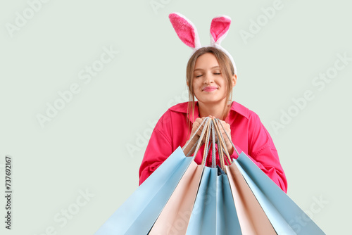 Young woman in bunny ears w...