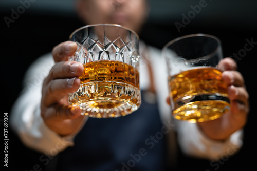 Barman pouring whiskey whiskey glass beautiful night