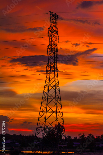 High-voltage electric poles and colorful sunset sky