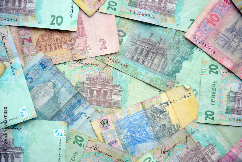 Processed collage of Ukrainian Hryvnia UAH bills banknotes texture. Background for banner Processed collage of Ukrainian Hryvnia UAH bills banknotes texture. Background for banner