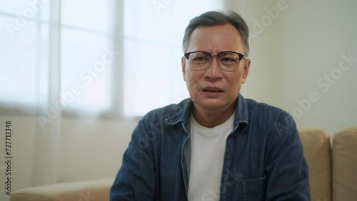 Upset asian senior man worried about problem, unhappy elder man feeling annoyed with health problem, retired man thoughtful confused memory problem.
 photo
