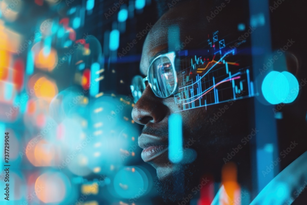 Businessman looking to screen computer with reflection of display stock market chart, coding on his face  - obrazy, fototapety, plakaty 