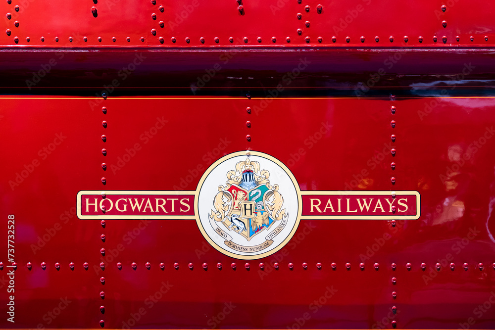 Fototapeta premium JAPAN - NOV 13, 2023: Hogwarts Railways logo on red train side destination to magical school in Warner Bros. Studio Tour Tokyo Japan, The Making of Harry Potter