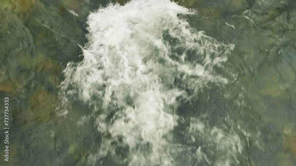 Wild mountain river on the river rapids. On the rapids water hitting ...