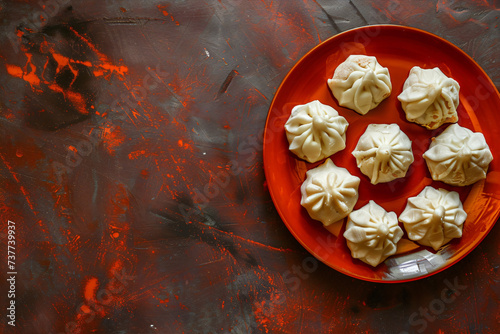 Holi Festival dish- Kaju Modak. Traditional food for Holi or Gudi Padva festival. Recipe ingredients. Copy space. Top view photo