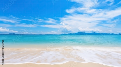 Sandy Beach With Blue Sky and Ocean in Background