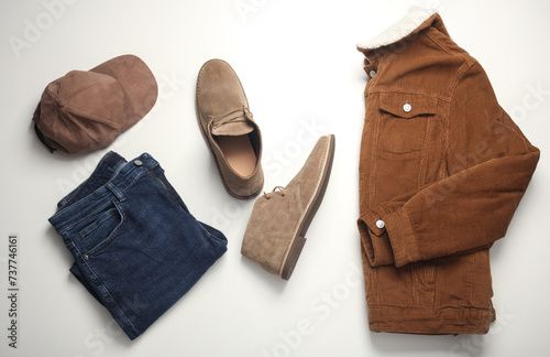 Men's clothes, shoes and accessories on a white background. Autumn seasonal clothing. Top view. Flat lay