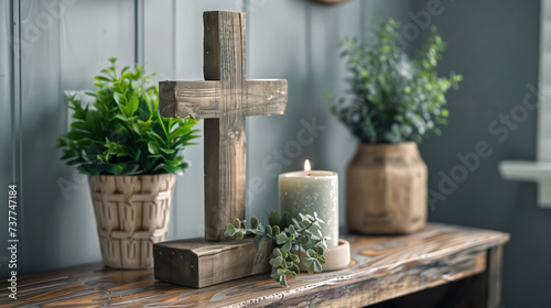 wooden cross with candle and plant decoration desk