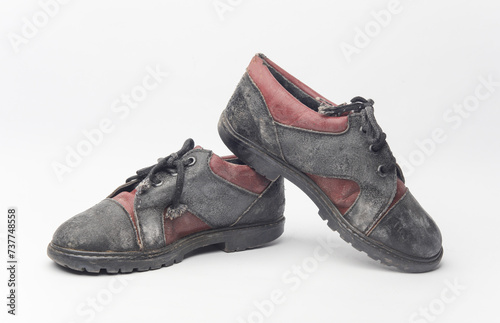 Children's used shoes on white background