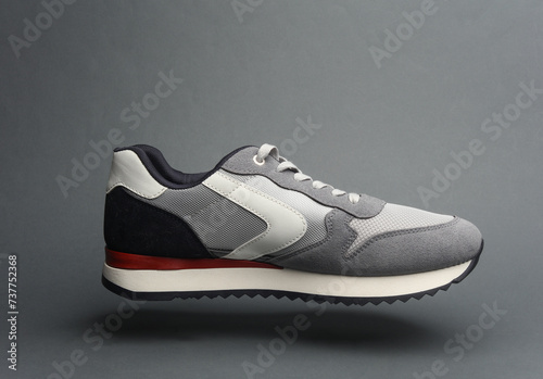 Sneaker floating on a dark gray background