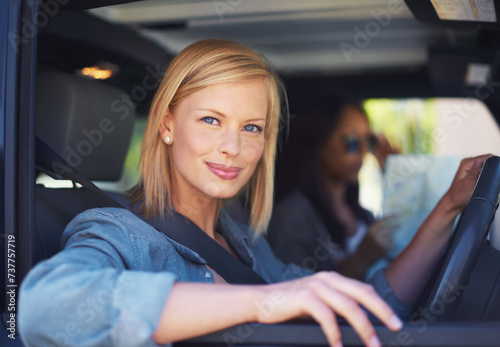 Woman, friends and map in car for road trip with happy direction, guide or information of location on a travel journey. Portrait of a driver or friends with safety, transport and ready for vacation © Mapodile M./peopleimages.com