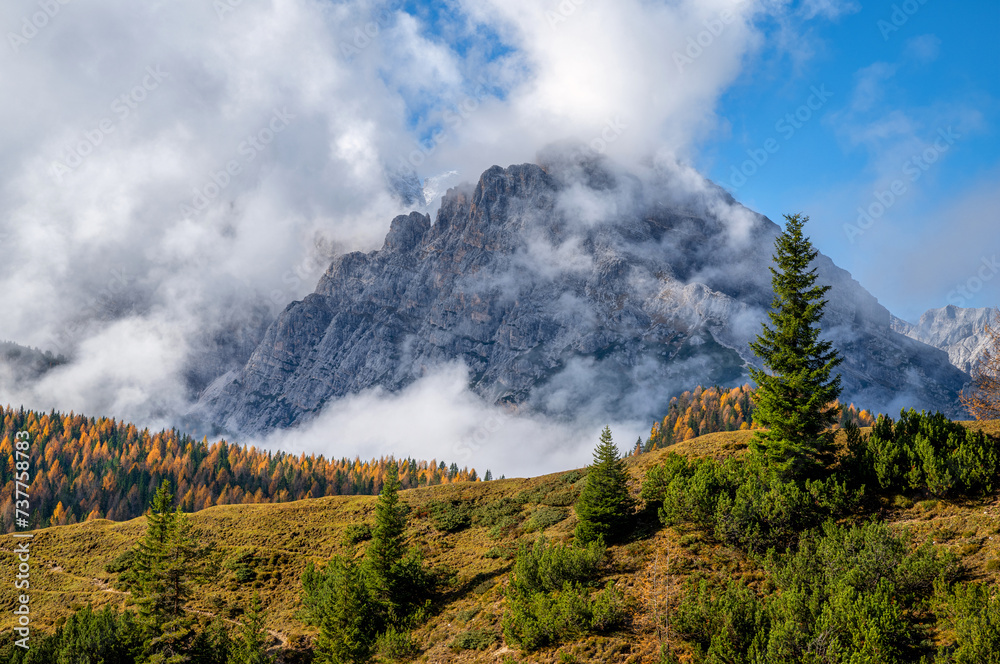 Mountains range covered with fog during autumn