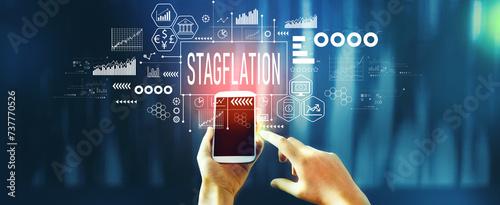 Stagflation theme with person using a smartphone photo