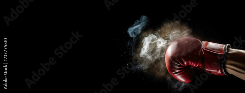 A hand in a boxing glove throws a punch, dark background isolate. © Serhii