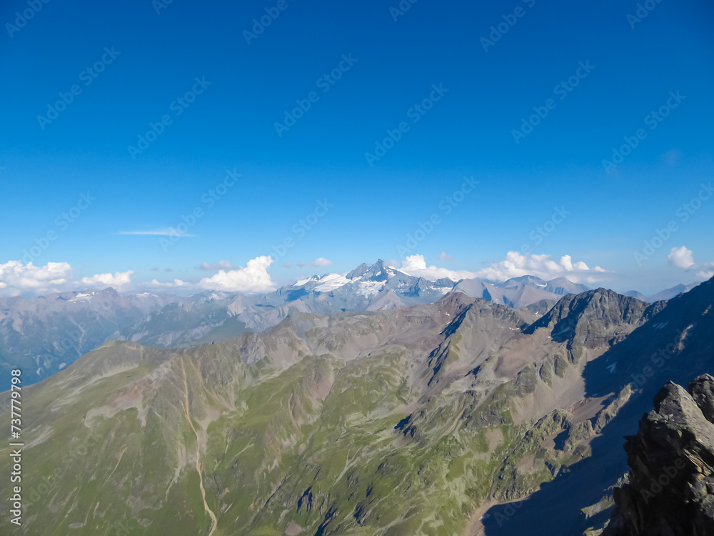 Scenic view of the majestic mountain ridges of High Tauern seen near Gloedis in Schober group, East Tyrol, Austria, EU. Idyllic high alpine landscape in Austrian Alps. Looking at summit Grossglockner