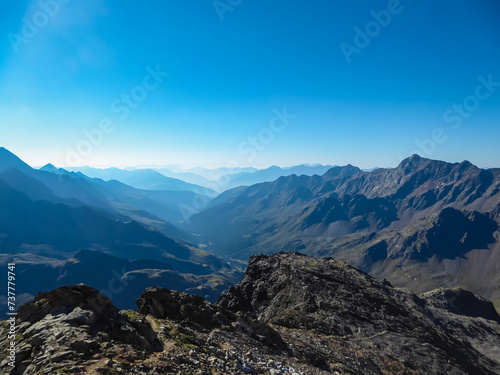 Panoramic view of the majestic mountain ridges of High Tauern seen near Gloedis in Schober group, East Tyrol, Austria, EU. Idyllic high alpine landscape in Austrian Alps. Tranquil serene atmosphere