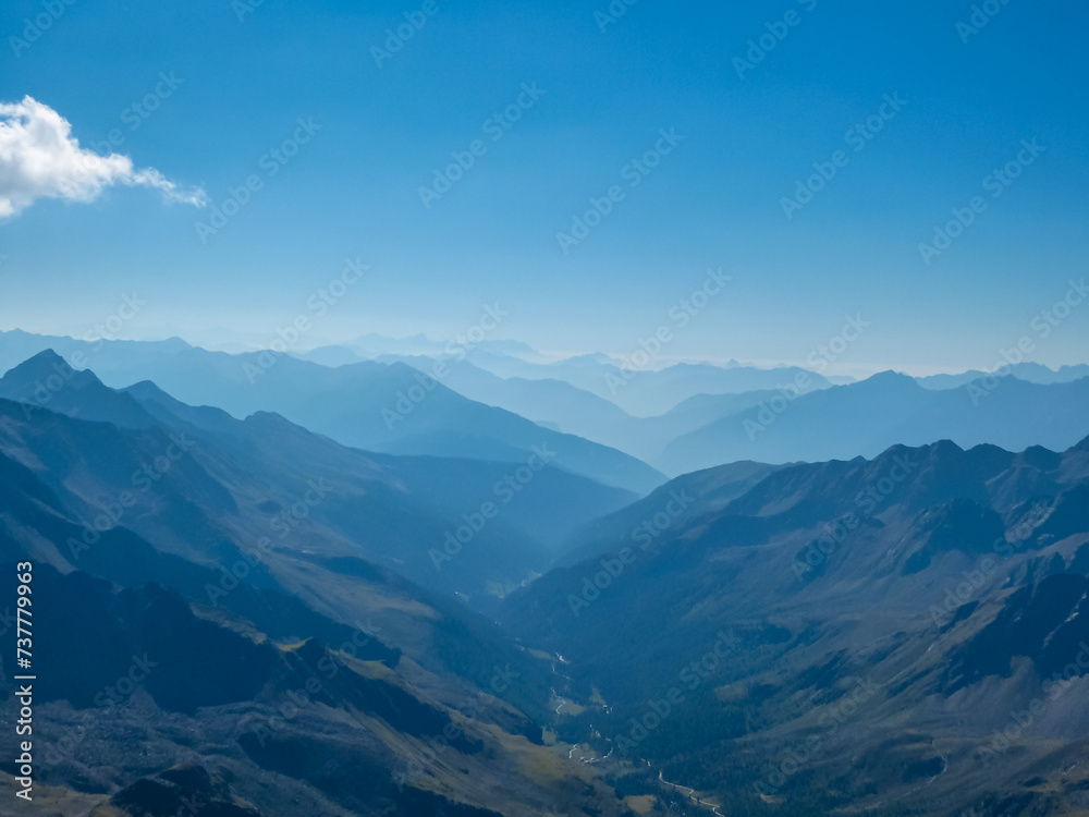 Panoramic view of the majestic mountain ridges of High Tauern seen near Gloedis in Schober group, East Tyrol, Austria, EU. Idyllic high alpine landscape in Austrian Alps. Tranquil serene atmosphere