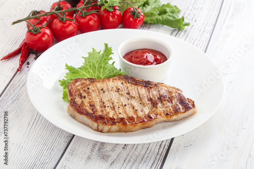 Grilled pork steak with ketchup