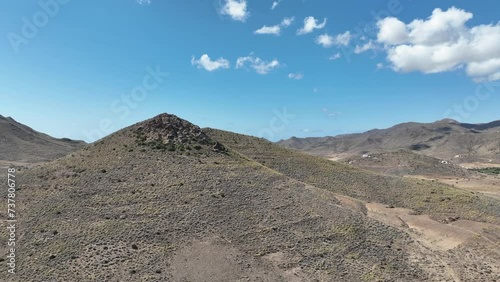 Aerial close up towards stark extinct volcanic cone Almeria Spain