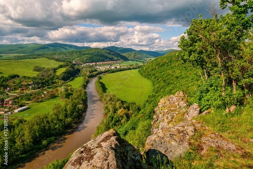 Serene sunset landscape by the Hron River, Slovakia. Discover the spring beauty of the mountains and river.  photo