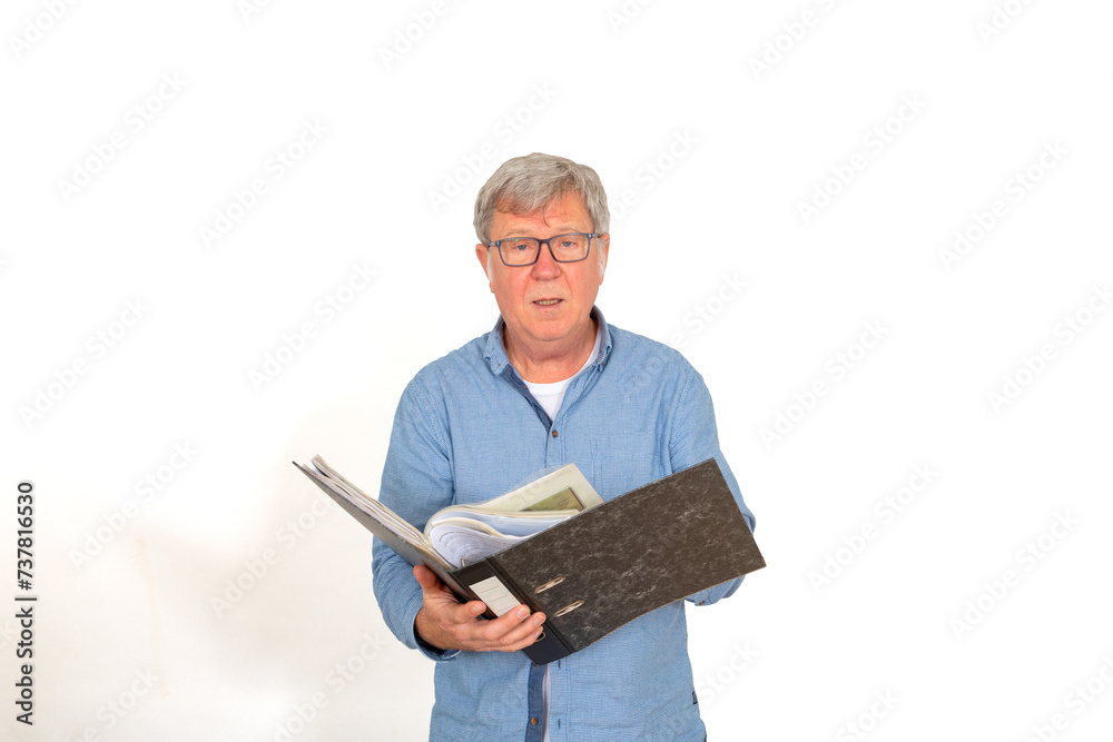 portrait of mature man in office oipening a file with documents portrait of mature man in office oipening a file with documents