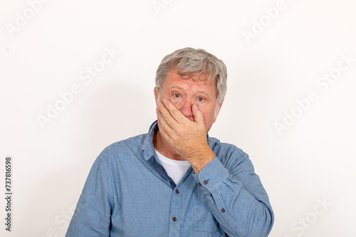 portrait of mature man surprised and looking in sorrow