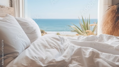 bedroom with white messy bedding and big window with view to beautiful. Summer, travel, vacation, holiday, mindfulness, relax, recreation, hotel, sleep