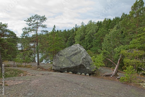 Large boulder in forest on the island of Linlo in cloudy autumn weather, Kirkkonummi, Finland. photo