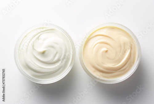 two bowls of white and yellow yogurt