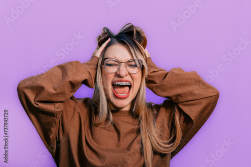 Women Day, March 8, empowered and self-confident woman. Woman expressing leadership and character. Girl with glasses. Purple background. Not one woman less. Woman screaming.
